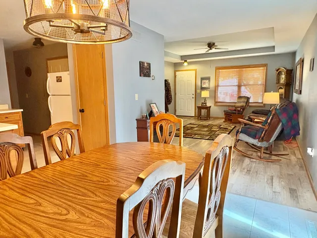 a view of a dining room with furniture window and outside view