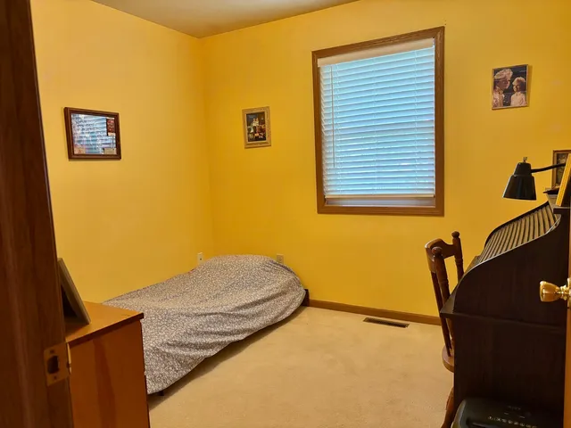 a view of a bedroom with windows