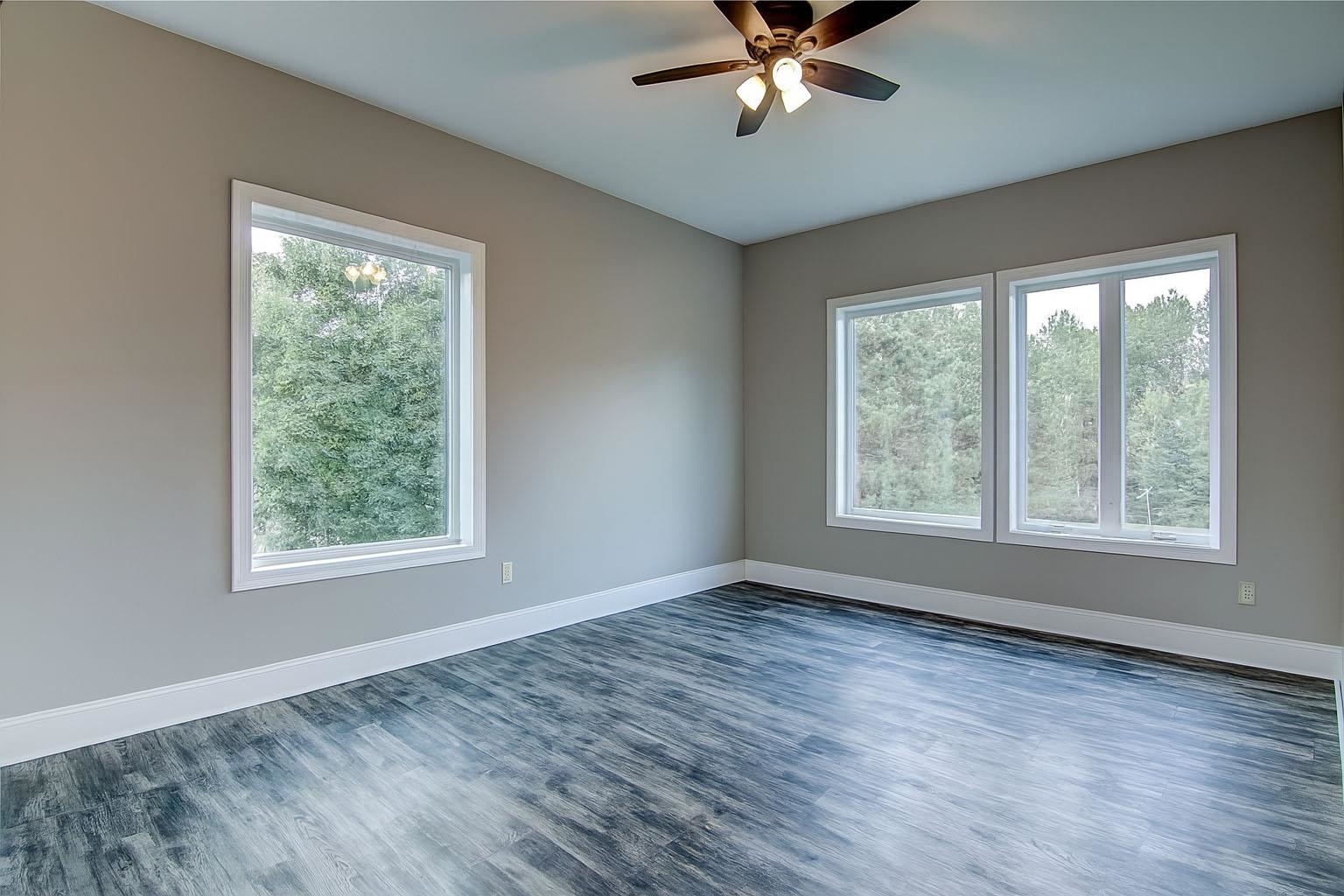 6030 Mitchell Road Iron River, WI 54847 - Photo 16 of 45 Unfurnished room with wood finished floors and ceiling fan