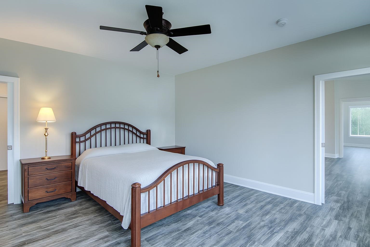 6030 Mitchell Road Iron River, WI 54847 - Photo 24 of 45 Bedroom with ceiling fan and wood finished floors