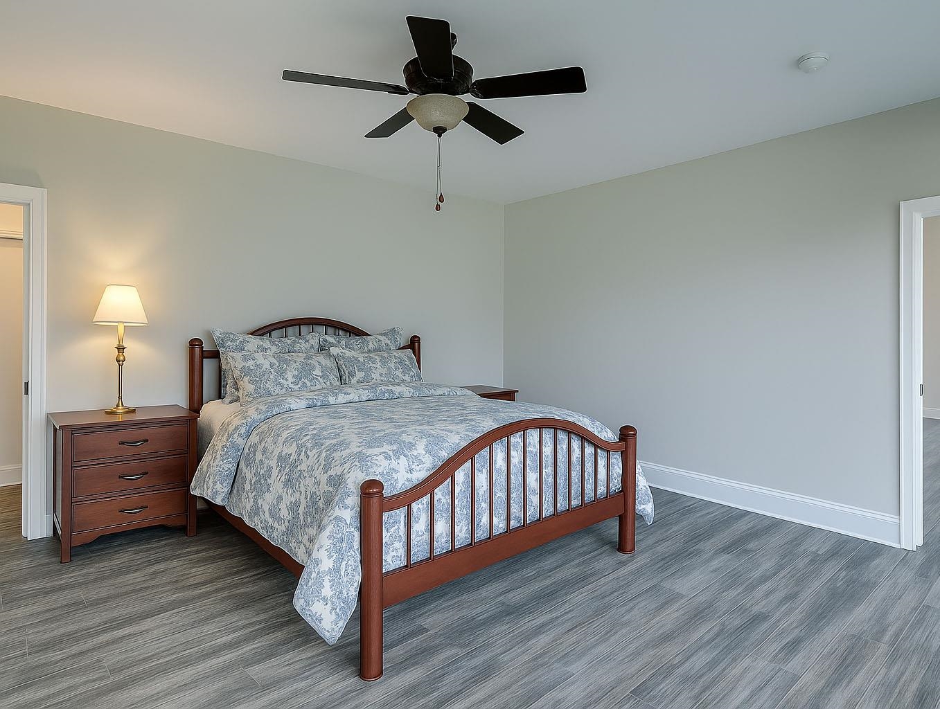6030 Mitchell Road Iron River, WI 54847 - Photo 25 of 45 Bedroom with ceiling fan and wood finished floors