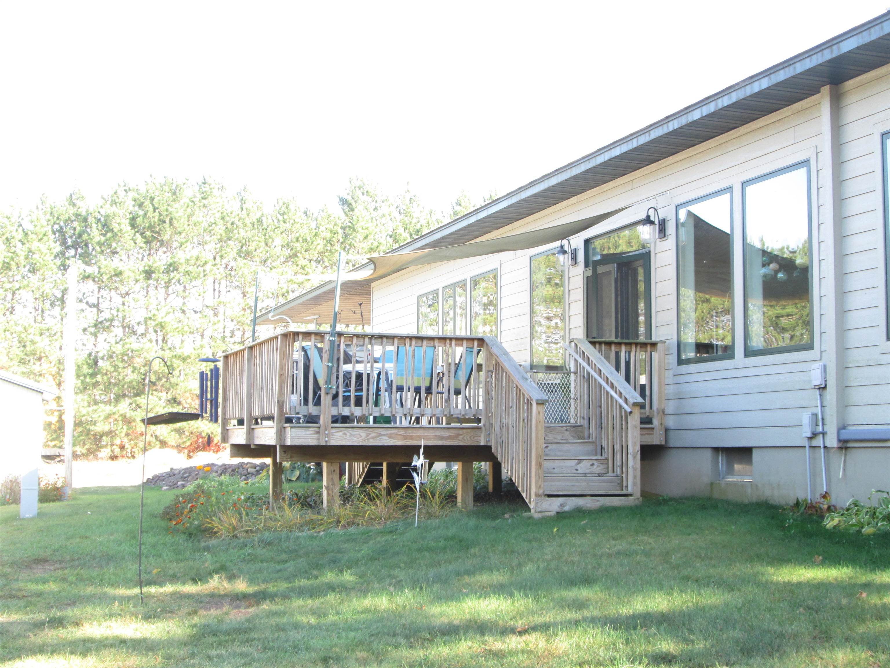 6030 Mitchell Road Iron River, WI 54847 - Photo 43 of 45 Deck featuring a yard