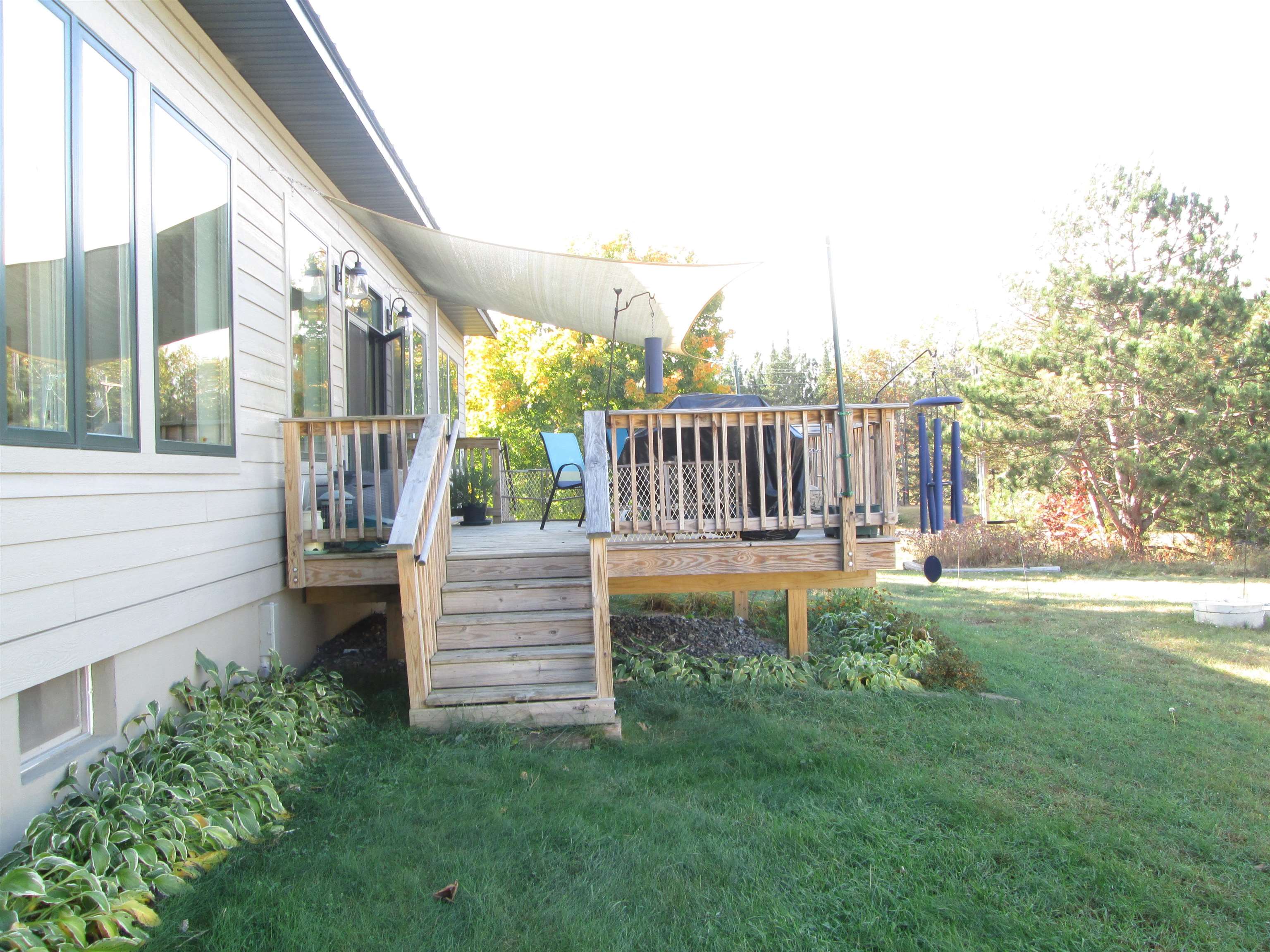6030 Mitchell Road Iron River, WI 54847 - Photo 44 of 45 Deck featuring a yard