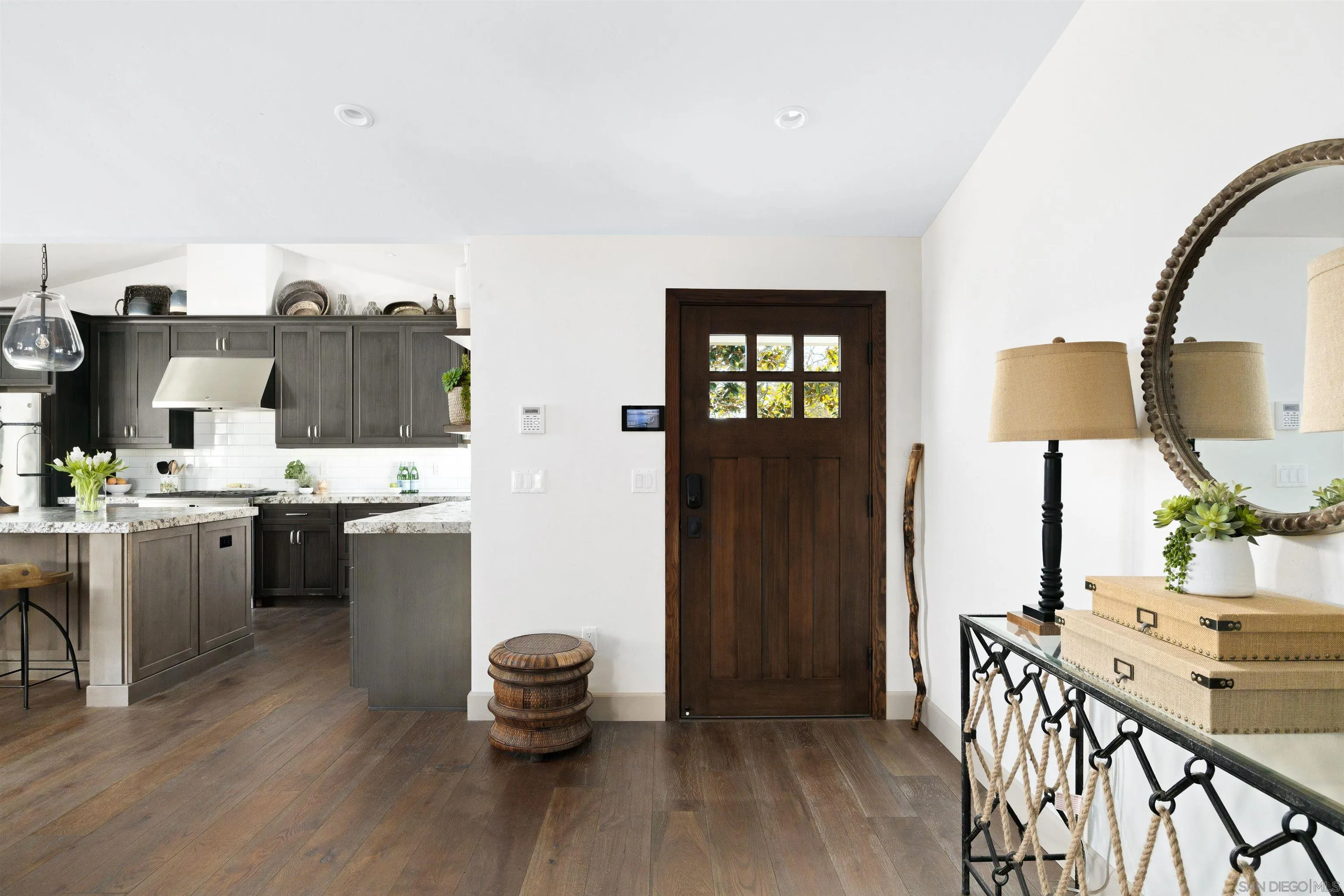 5351 Saxon Street San Diego, CA 92115 - Photo 12 of 34 a kitchen with a sink cabinets and wooden floor