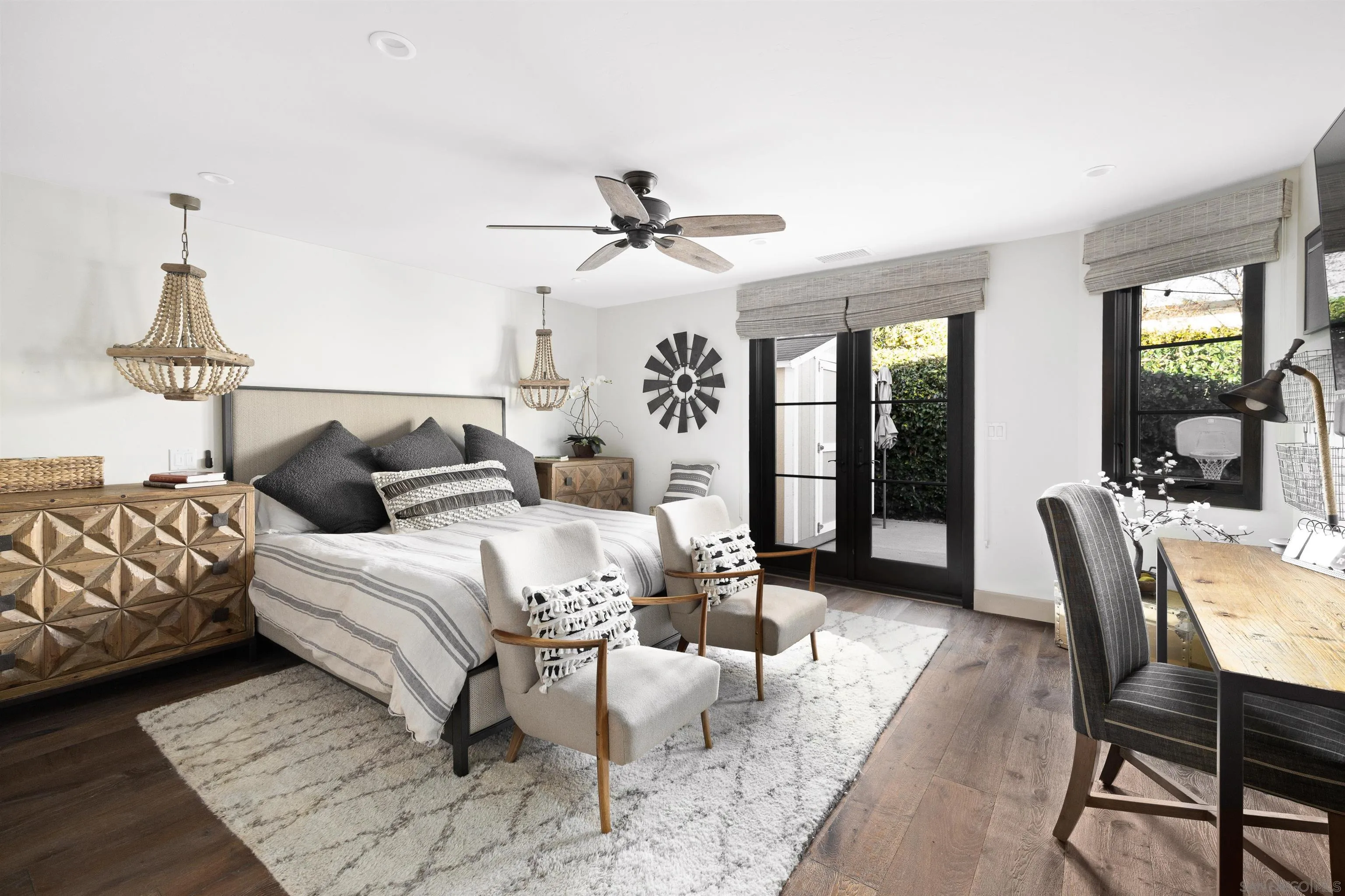 5351 Saxon Street San Diego, CA 92115 - Photo 13 of 34 a bedroom with furniture and a chandelier