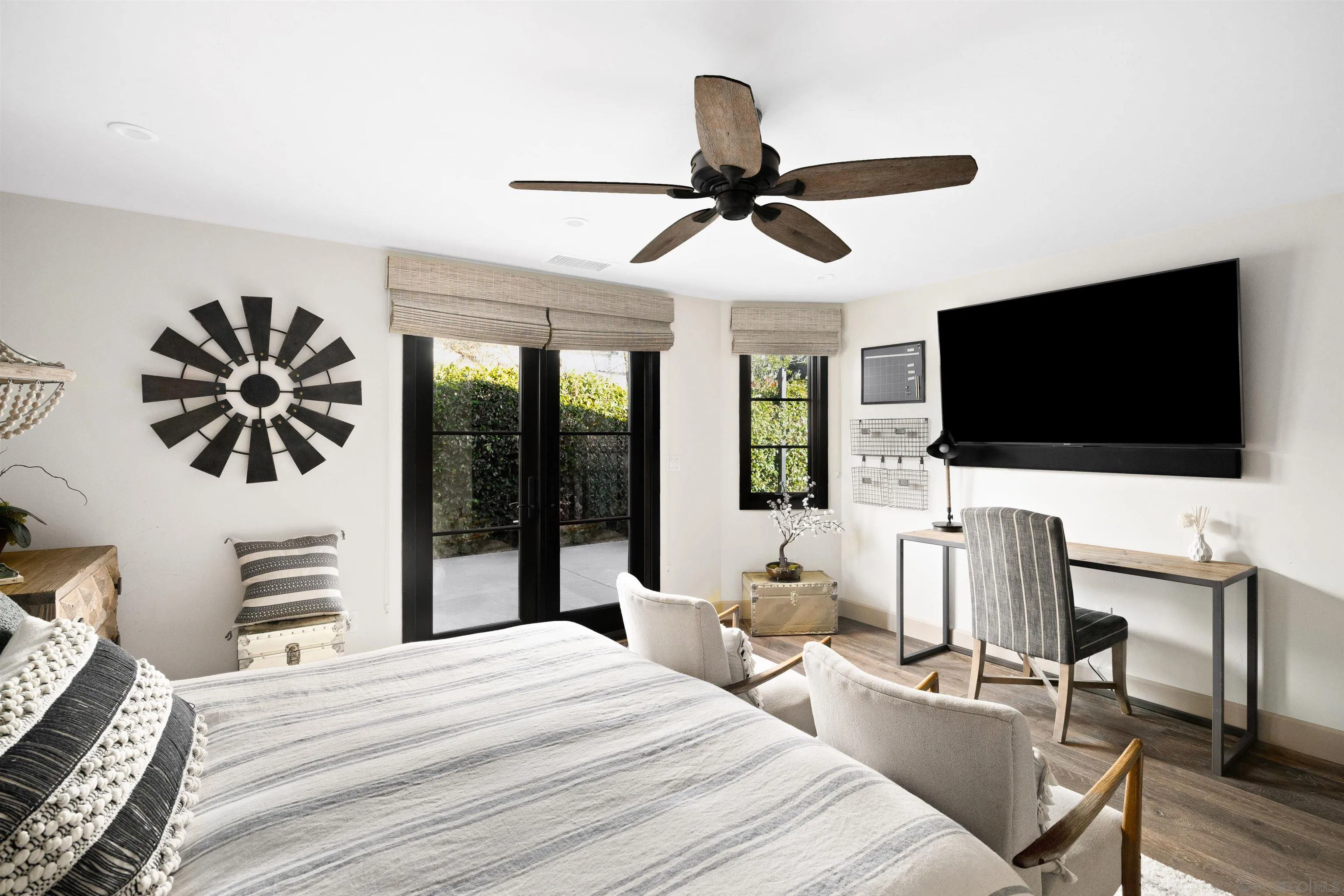 5351 Saxon Street San Diego, CA 92115 - Photo 14 of 34 a bedroom with a bed and a flat screen tv