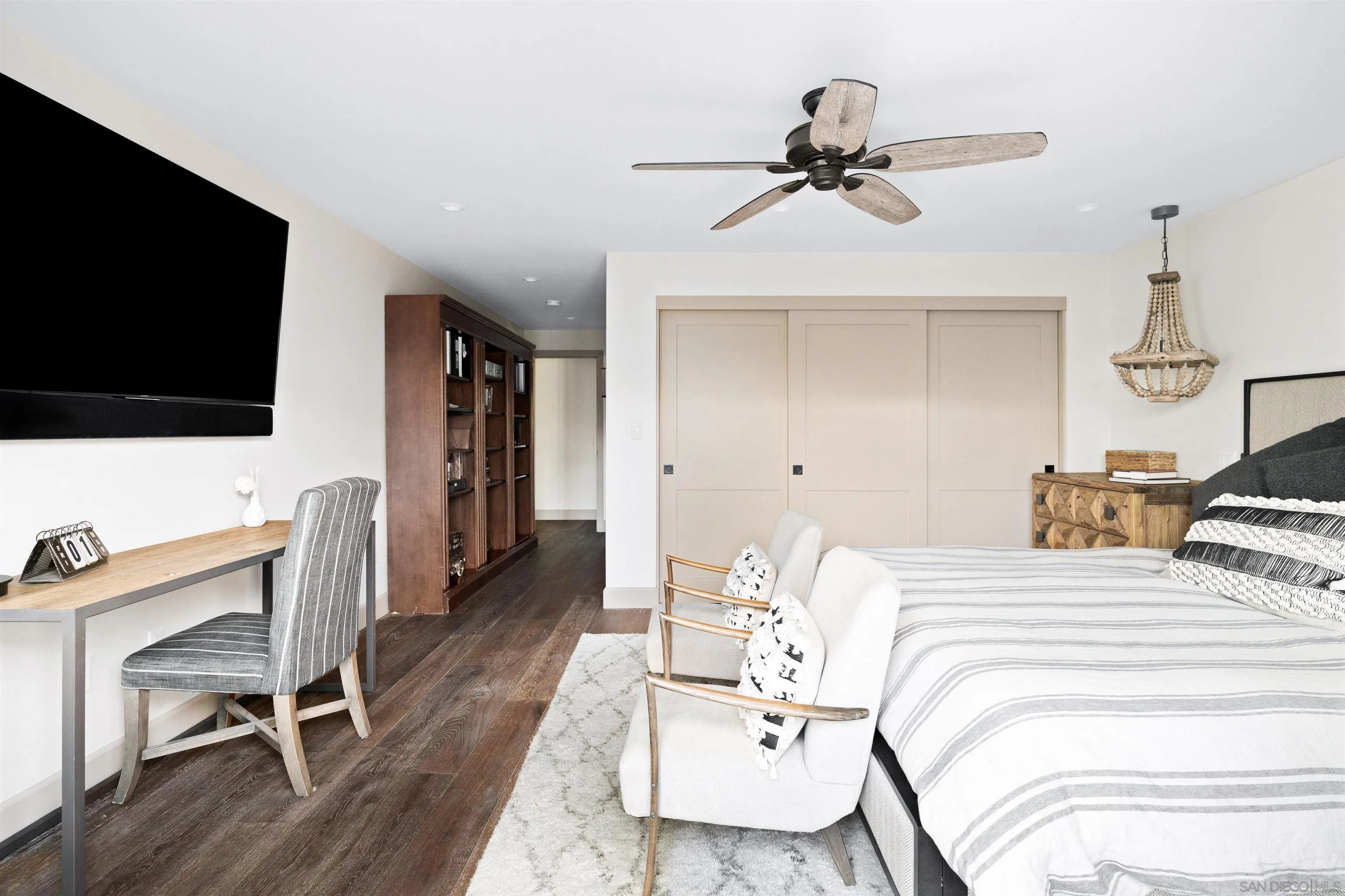 5351 Saxon Street San Diego, CA 92115 - Photo 15 of 34 a bedroom with a bed and a flat screen tv