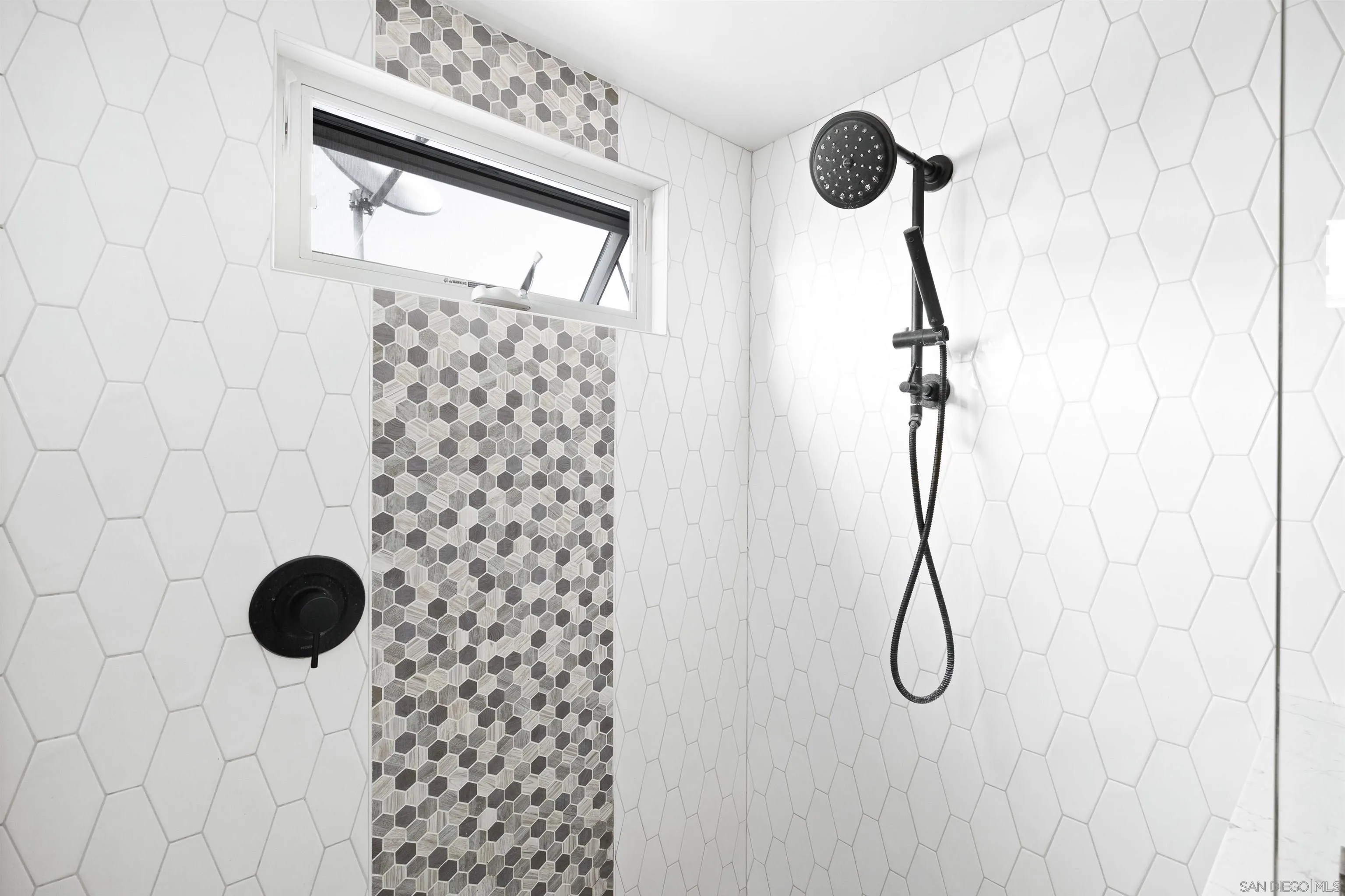 5351 Saxon Street San Diego, CA 92115 - Photo 18 of 34 a bathroom with a shower