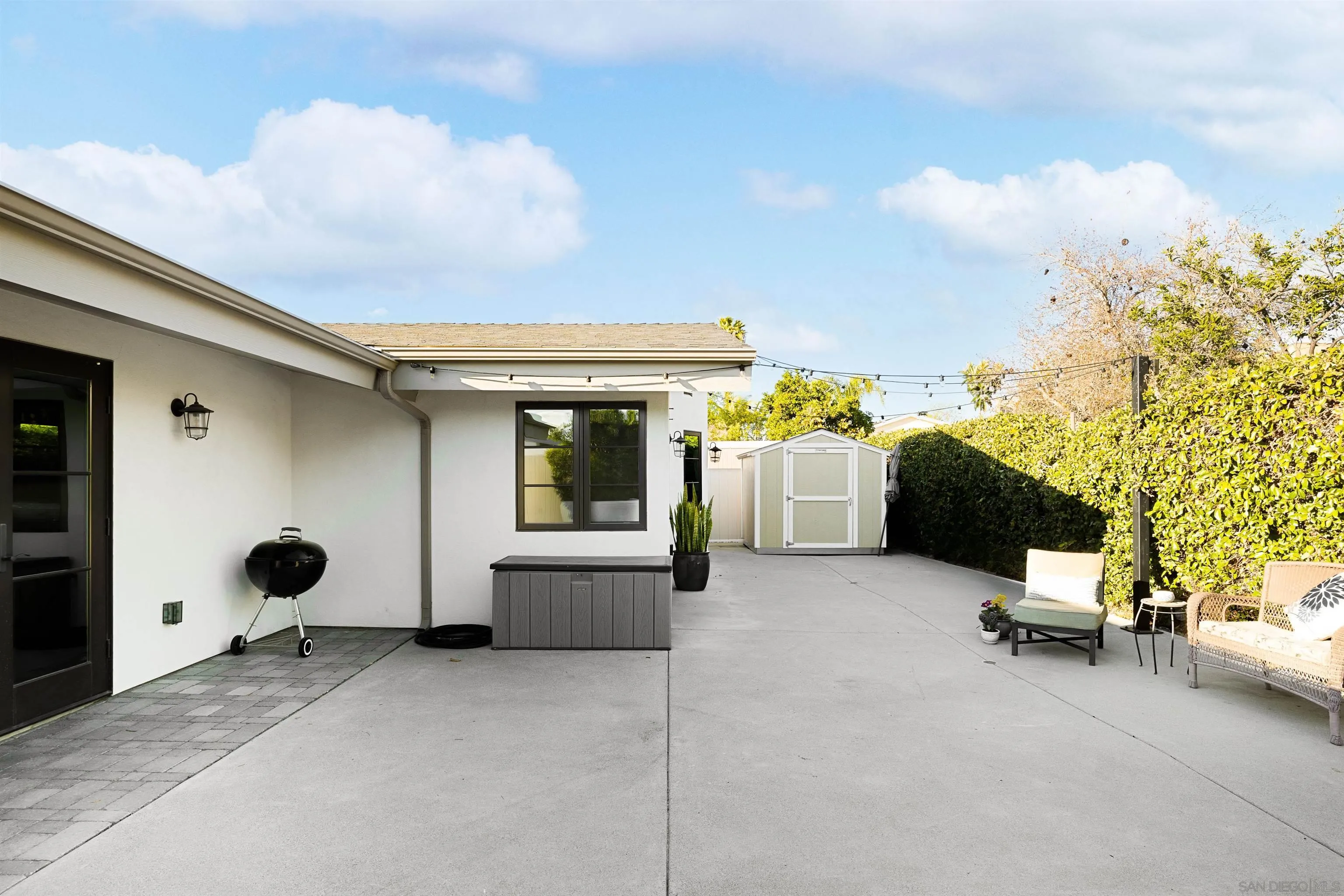 5351 Saxon Street San Diego, CA 92115 - Photo 29 of 34 a view of a patio with table and chairs and potted plants