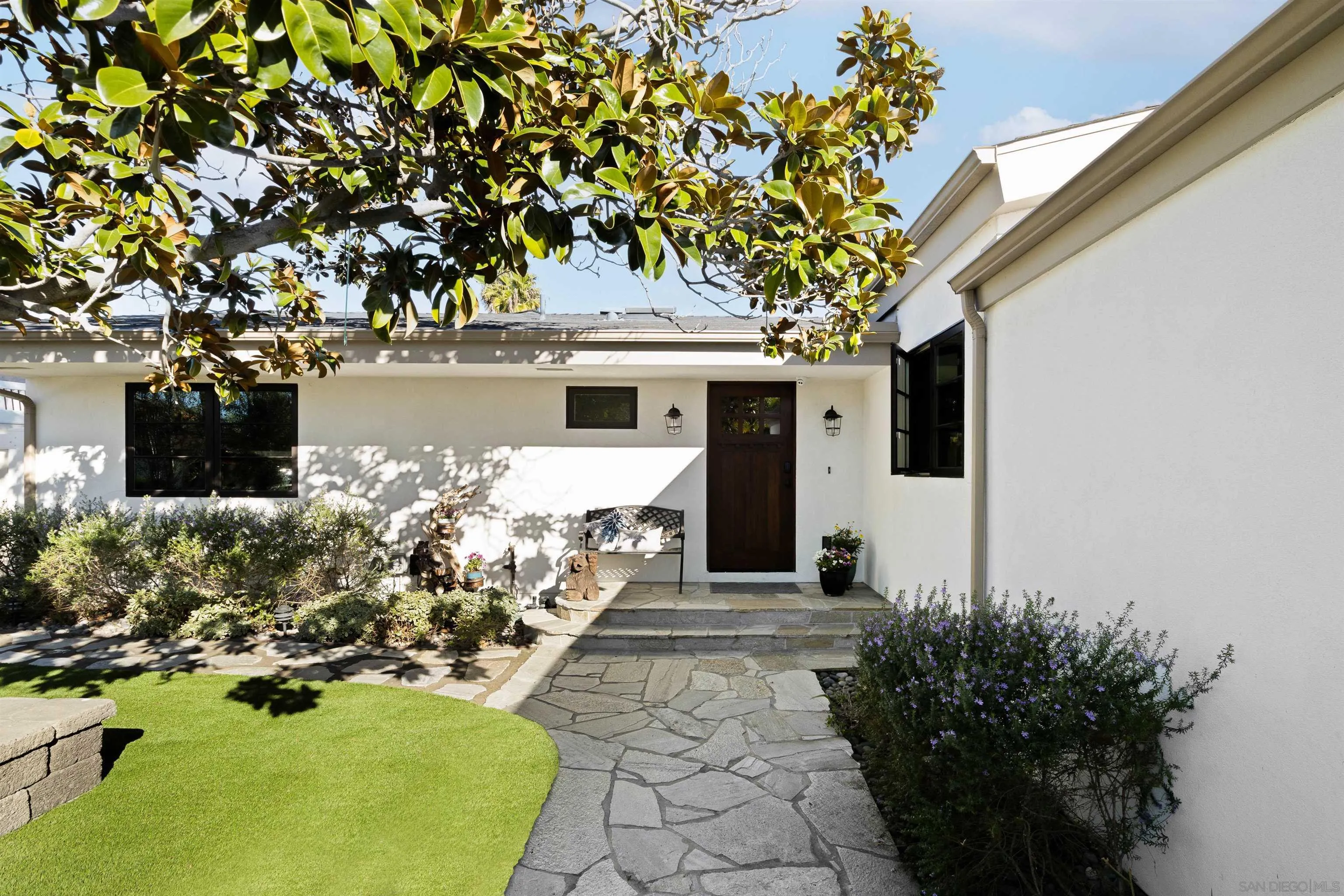 5351 Saxon Street San Diego, CA 92115 - Photo 30 of 34 a front view of a house with garden