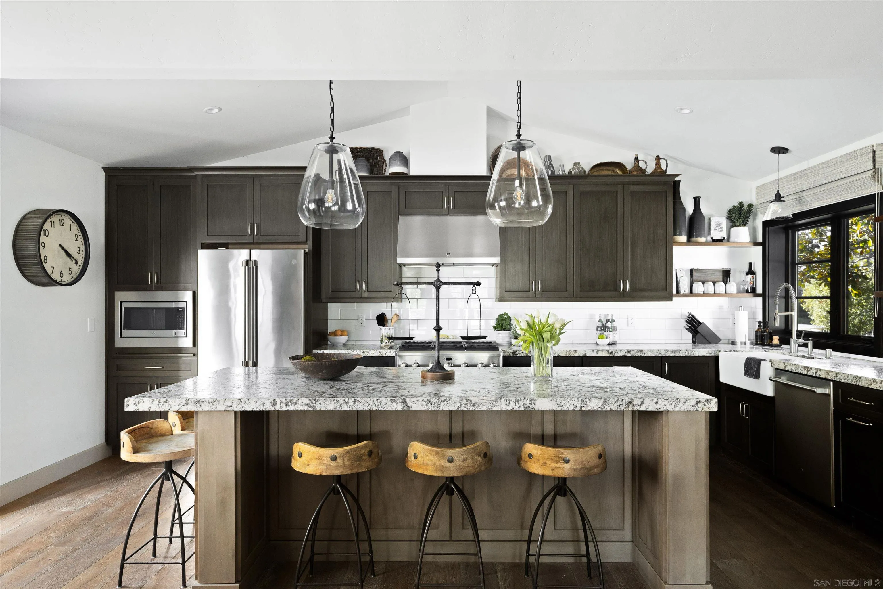5351 Saxon Street San Diego, CA 92115 - Photo 3 of 34 a kitchen with stainless steel appliances granite countertop a kitchen island a stove and a cabinets