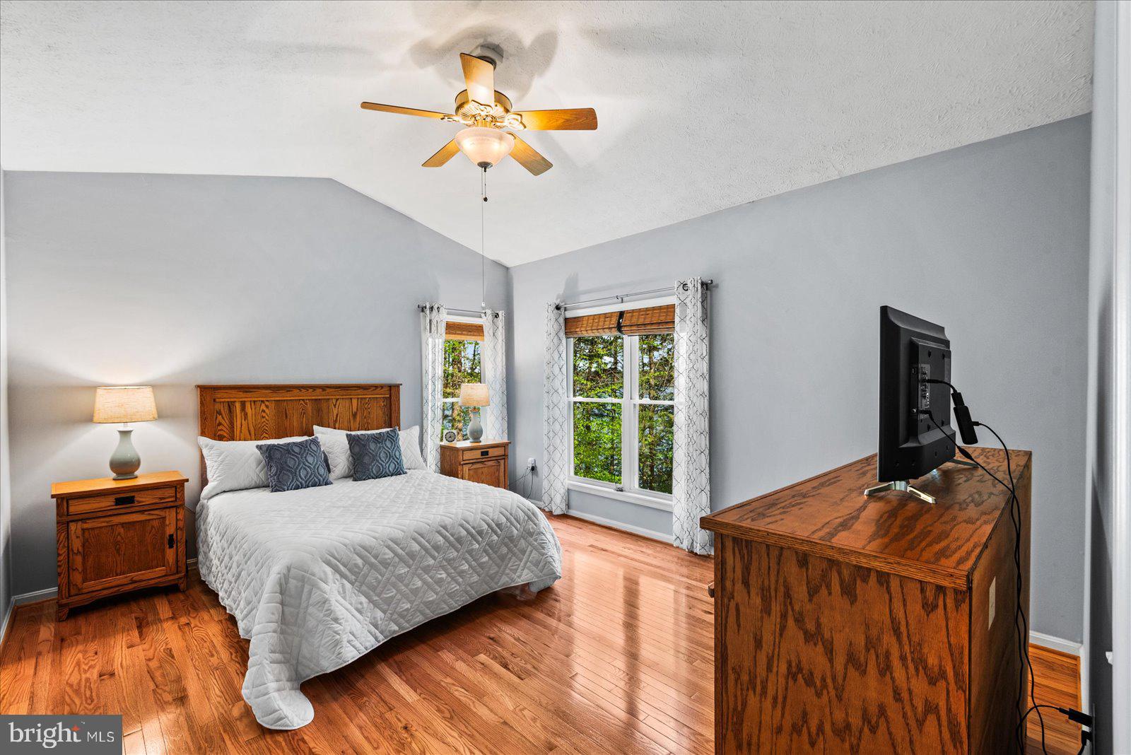 8 Franklin Cove Ruther Glen, VA 22546 - Photo 17 of 70 a bedroom with a bed and a chandelier