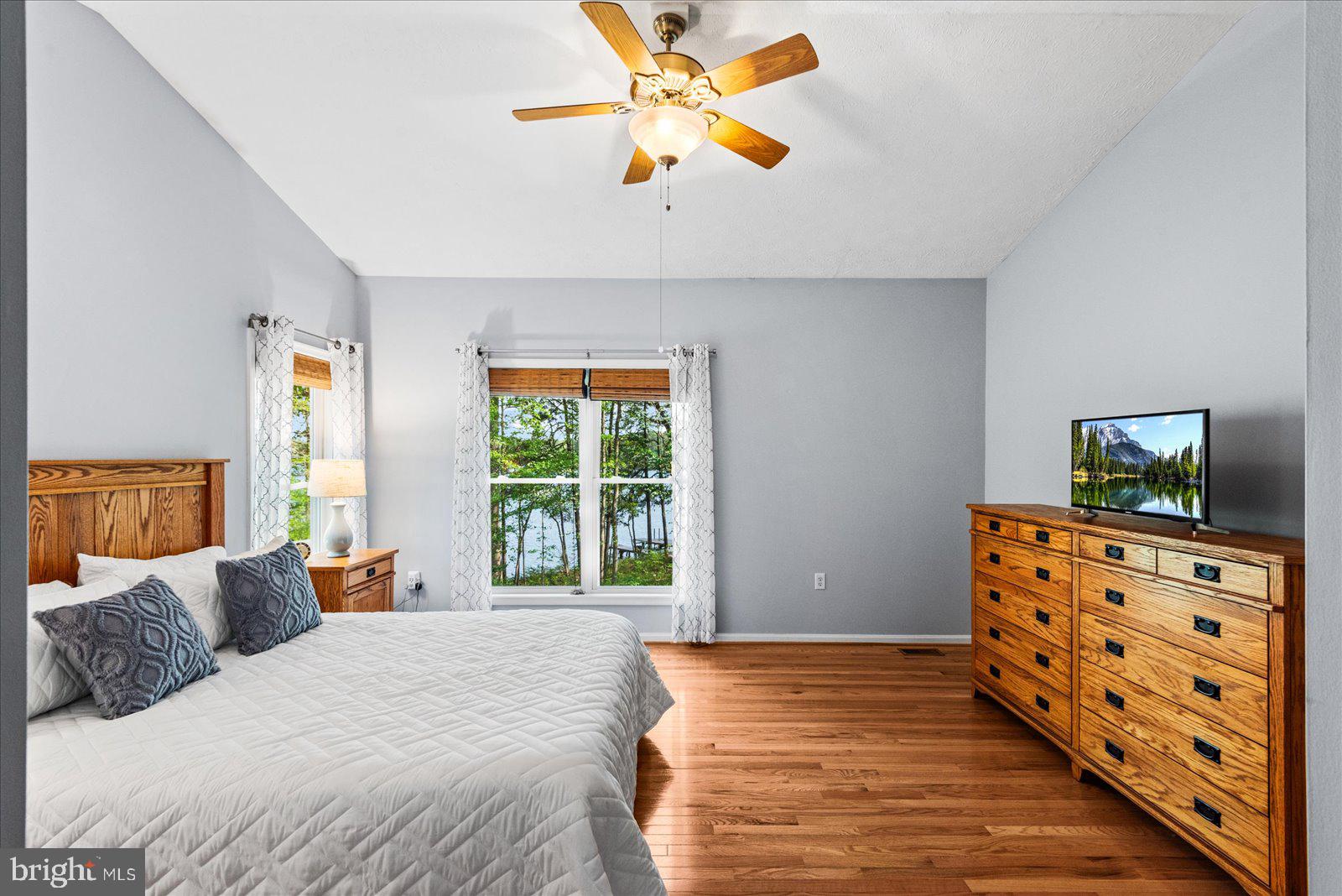 8 Franklin Cove Ruther Glen, VA 22546 - Photo 19 of 70 a bedroom with a bed and a chandelier