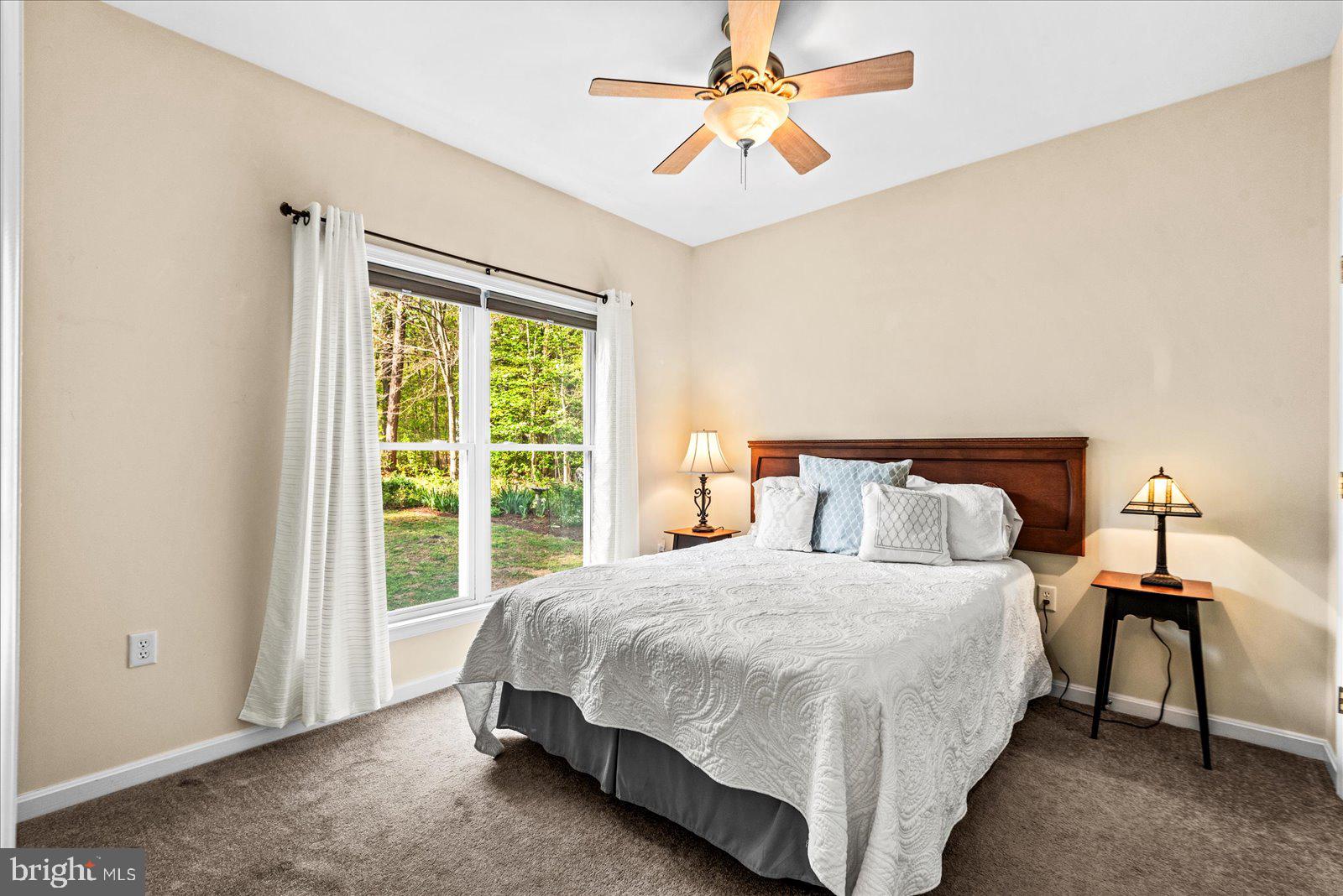8 Franklin Cove Ruther Glen, VA 22546 - Photo 25 of 70 a bedroom with a bed and a window