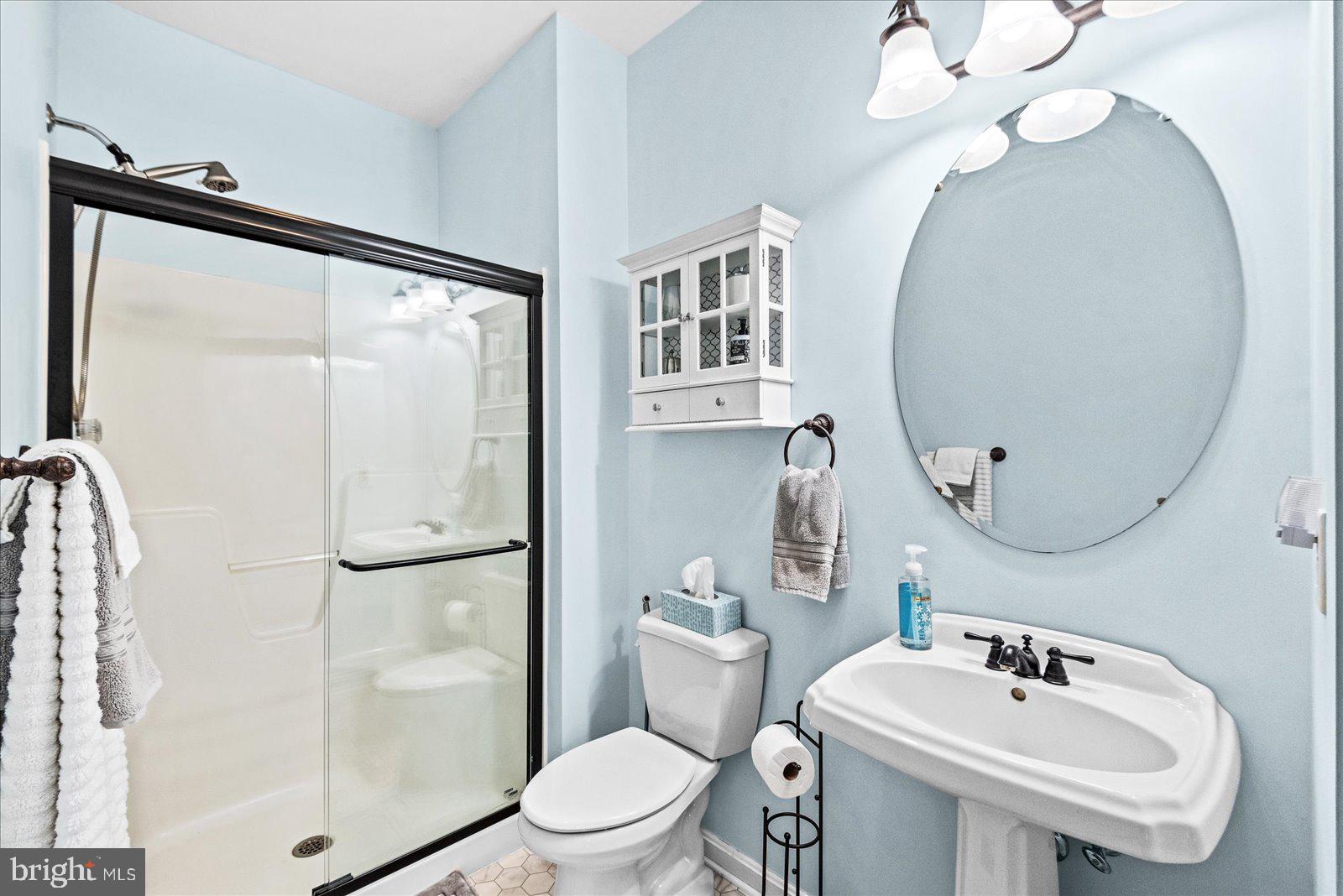8 Franklin Cove Ruther Glen, VA 22546 - Photo 28 of 70 a white toilet sitting next to a bathroom sink