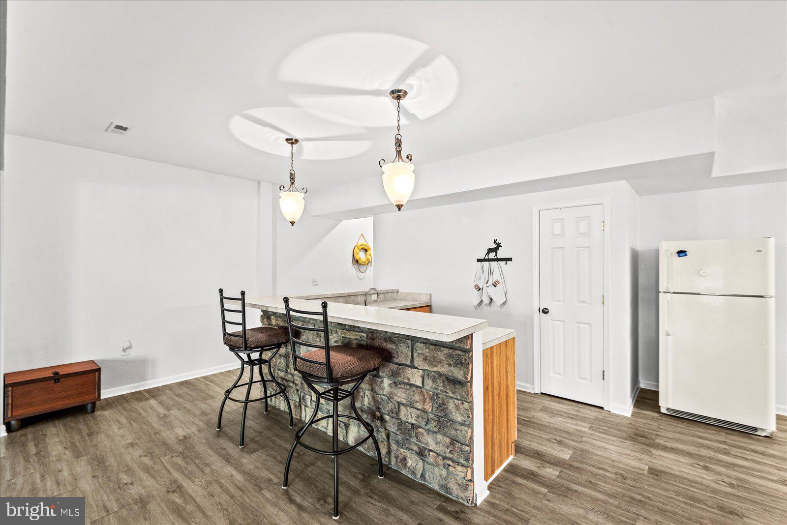 8 Franklin Cove Ruther Glen, VA 22546 - Photo 34 of 70 a view of a dining room with furniture and wooden floor