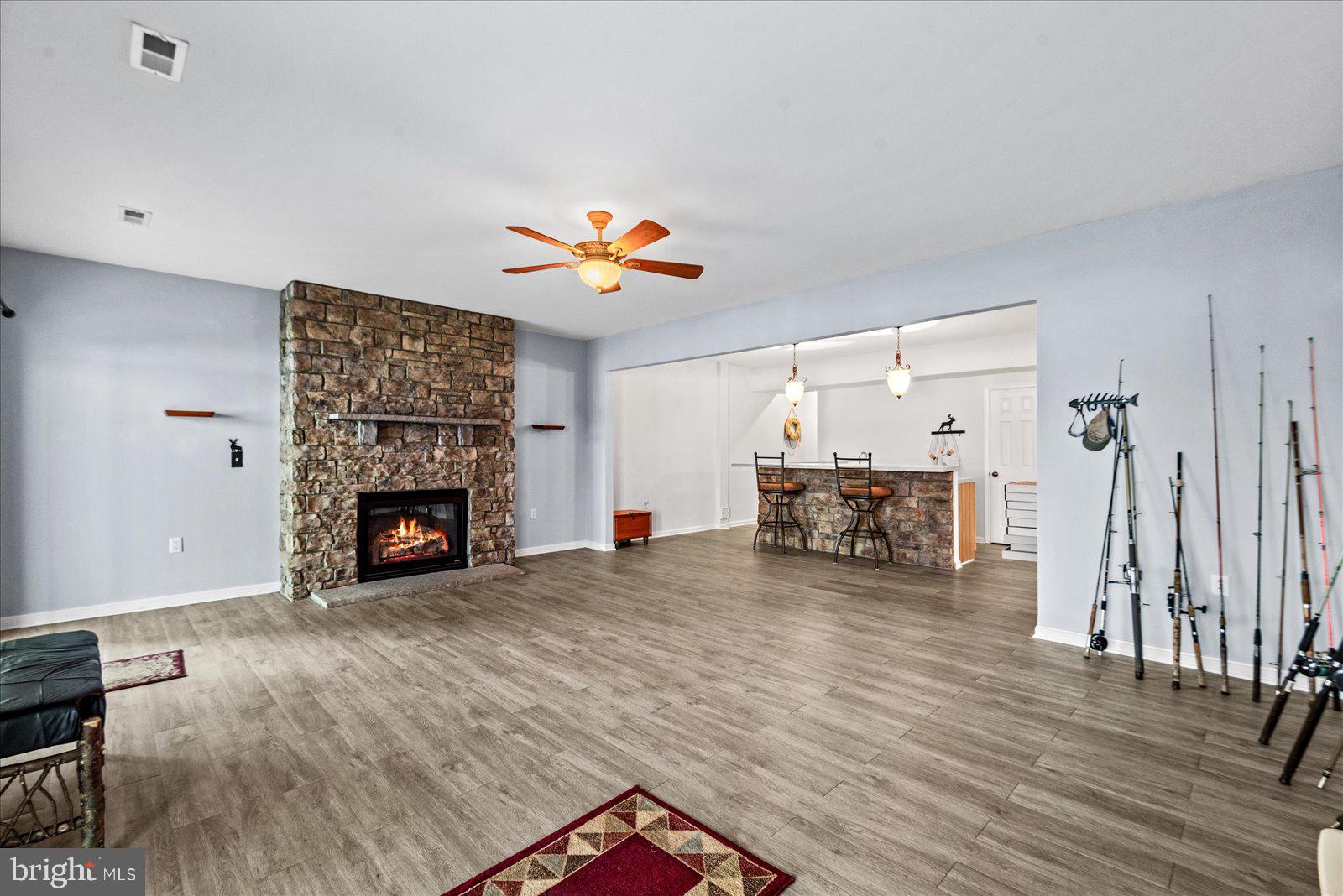 8 Franklin Cove Ruther Glen, VA 22546 - Photo 36 of 70 a view of a livingroom with a fireplace and a workspace