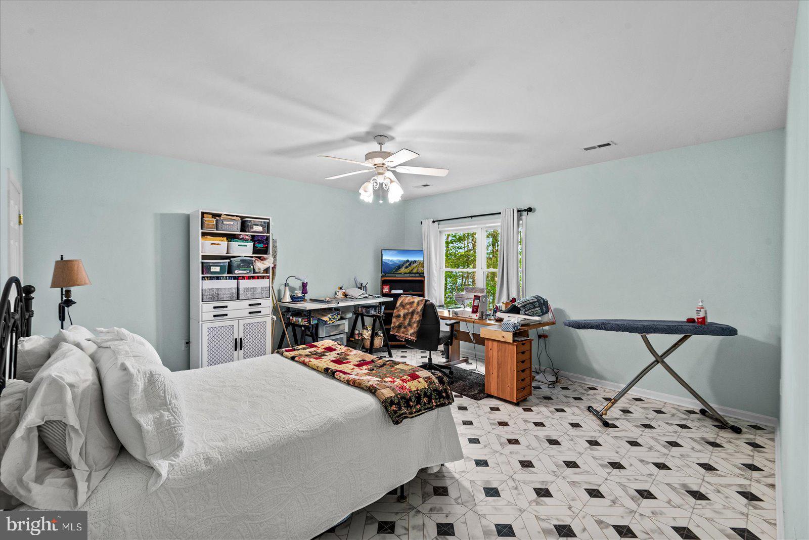 8 Franklin Cove Ruther Glen, VA 22546 - Photo 40 of 70 a bed room with a bed and a chair
