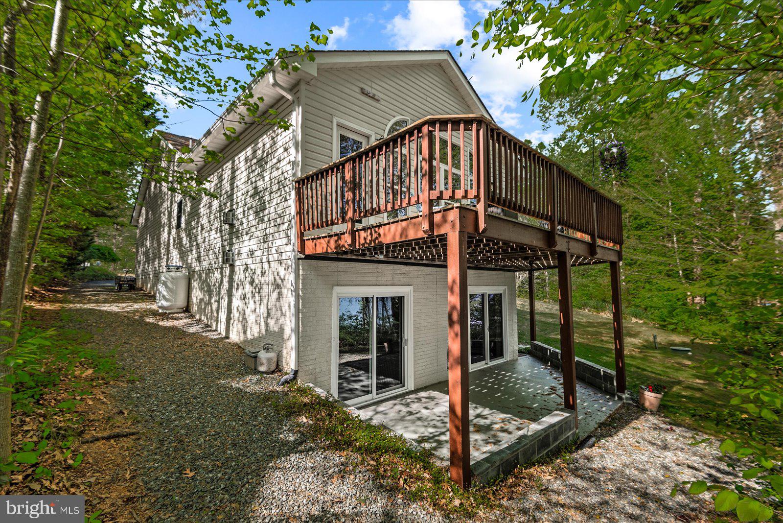 8 Franklin Cove Ruther Glen, VA 22546 - Photo 47 of 70 a view of a house with backyard and trees