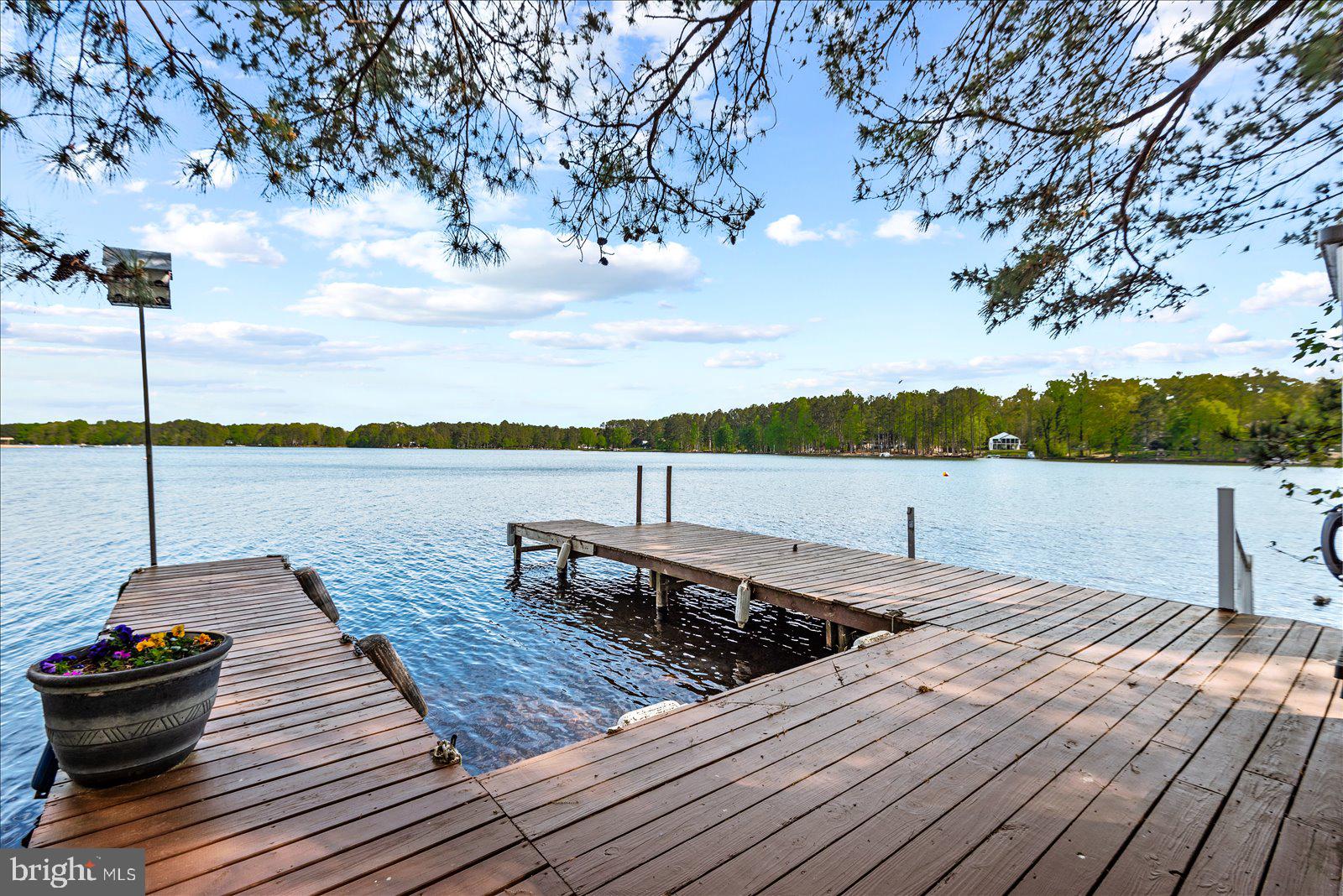 8 Franklin Cove Ruther Glen, VA 22546 - Photo 6 of 70 a view of a terrace with wooden floor and lake view