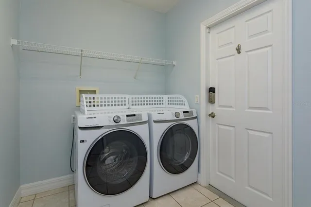 a utility room with dryer and washer