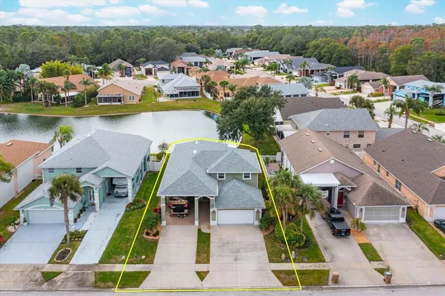 an aerial view of houses with swimming pool