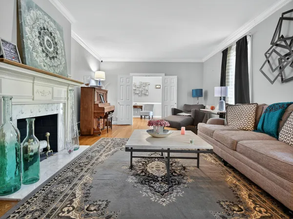 a view of a dining room with furniture and chandelier