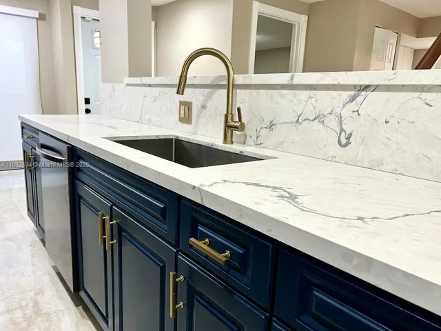 a bathroom with a sink and mirror
