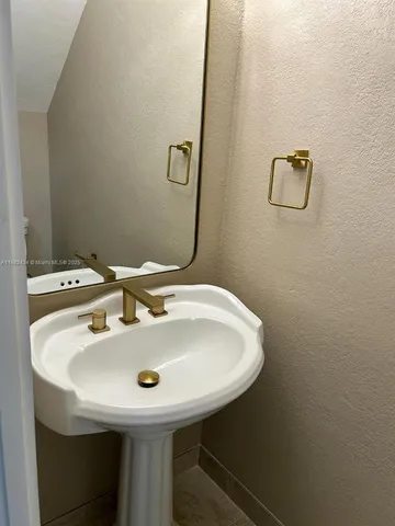 a bathroom with a sink and shower