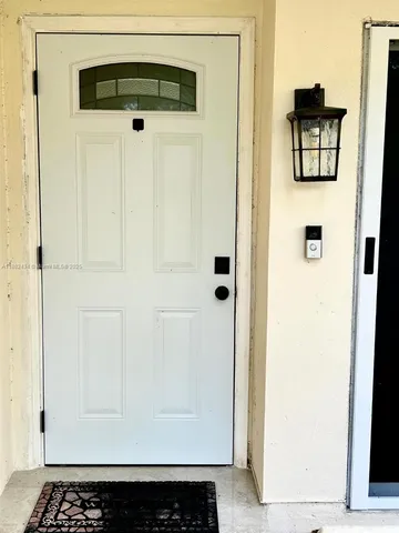 a view of a street with cars parked