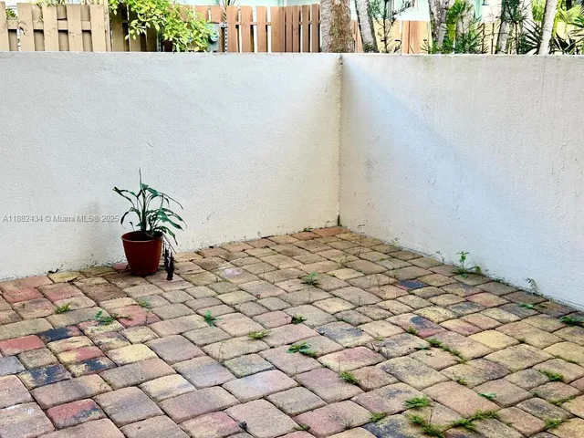 a view of two chairs in patio