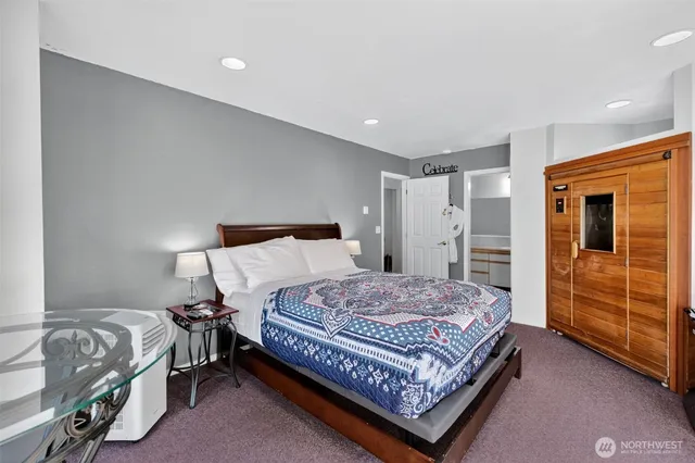 a bedroom with a bed and dresser