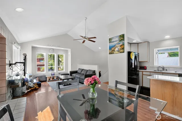 a living room with furniture fireplace and chandelier