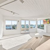 a large room with a large window and table