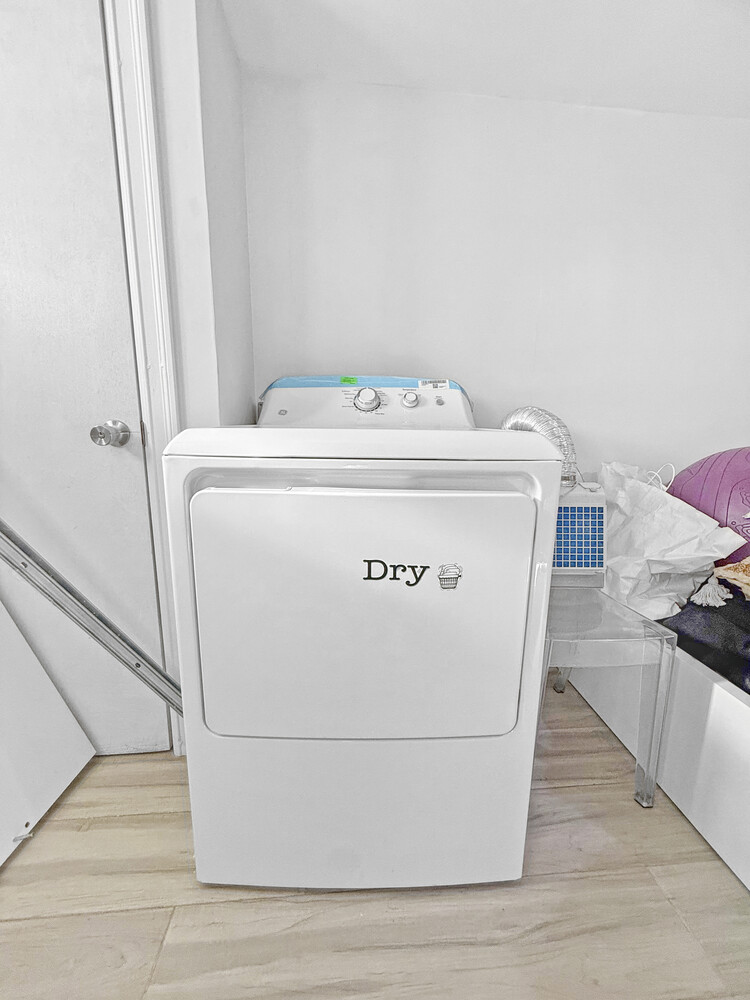 1353 Saint Marks Avenue, Unit 1 Brooklyn, NY 11233 - Photo 13 of 17 a utility room with washer and dryer