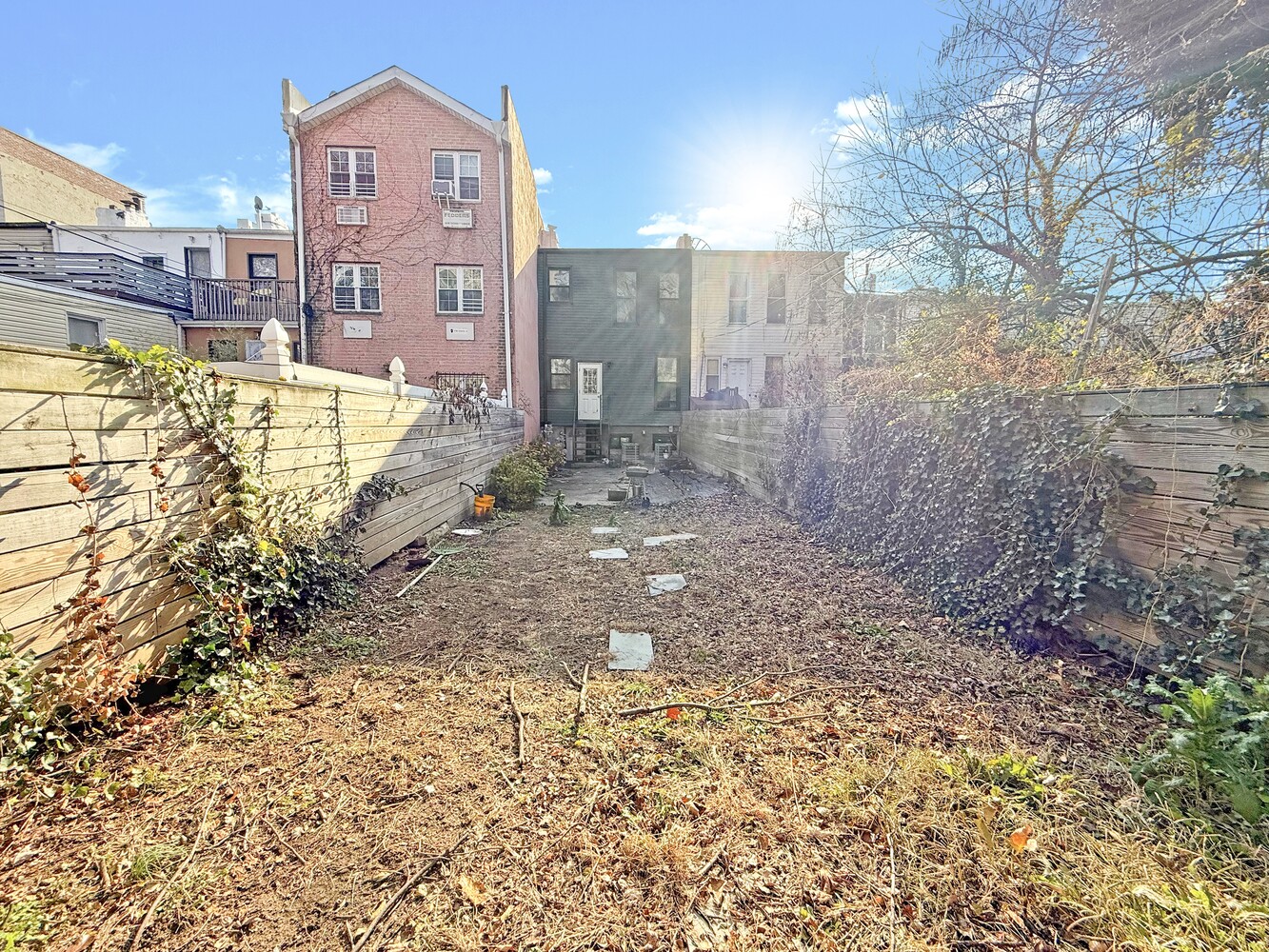 1353 Saint Marks Avenue, Unit 1 Brooklyn, NY 11233 - Photo 16 of 17 a view of a house with a yard