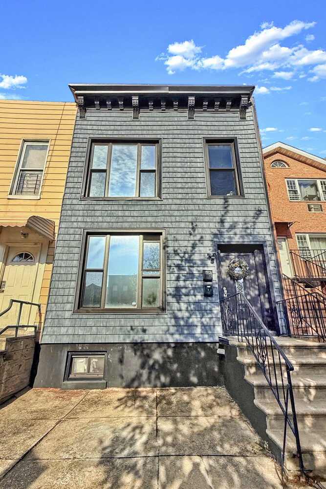 1353 Saint Marks Avenue, Unit 1 Brooklyn, NY 11233 - Photo 17 of 17 a front view of a house