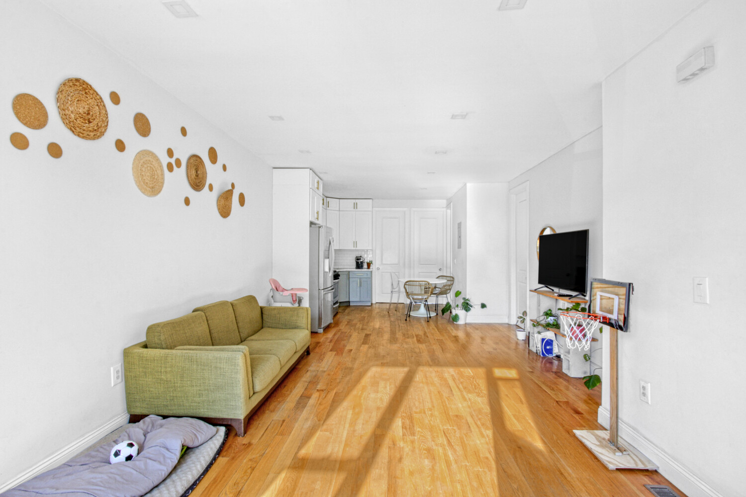 1353 Saint Marks Avenue, Unit 1 Brooklyn, NY 11233 - Photo 3 of 17 a bedroom with a bed and a couch