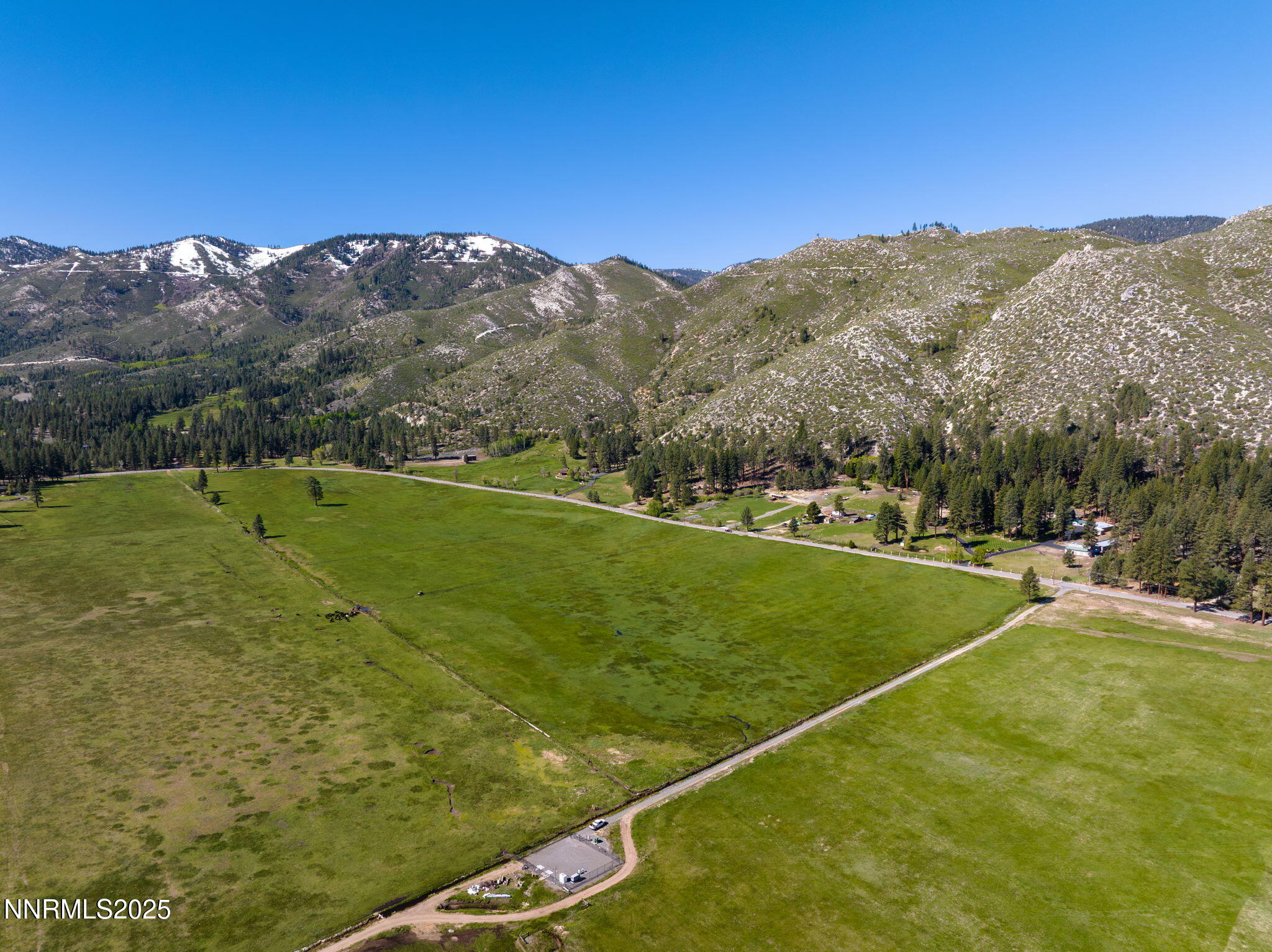 5 Franktown Road Washoe Valley, NV 89704 - Photo 2 of 17 a view of a field with a mountain in the background