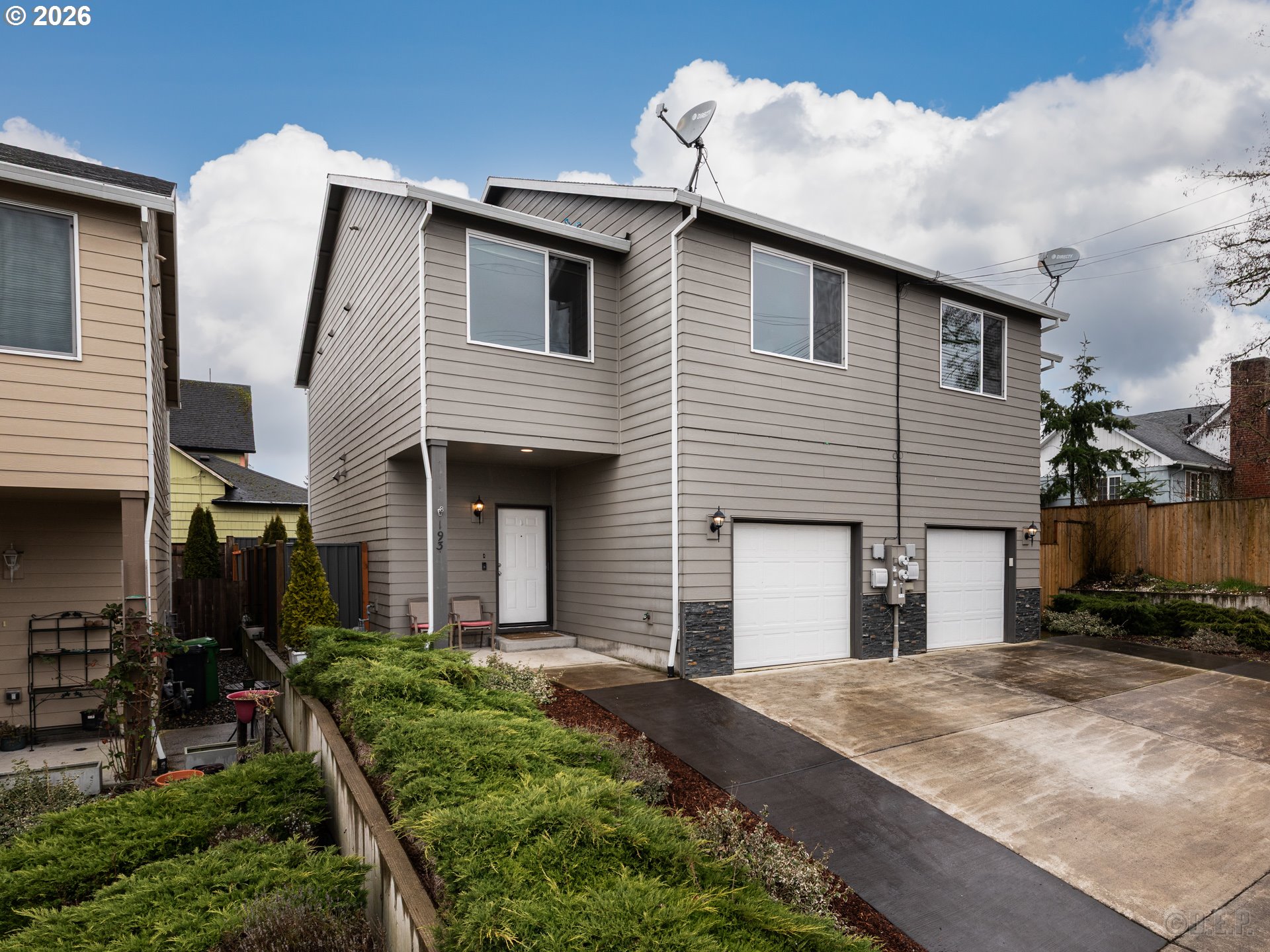 a front view of a house with garden