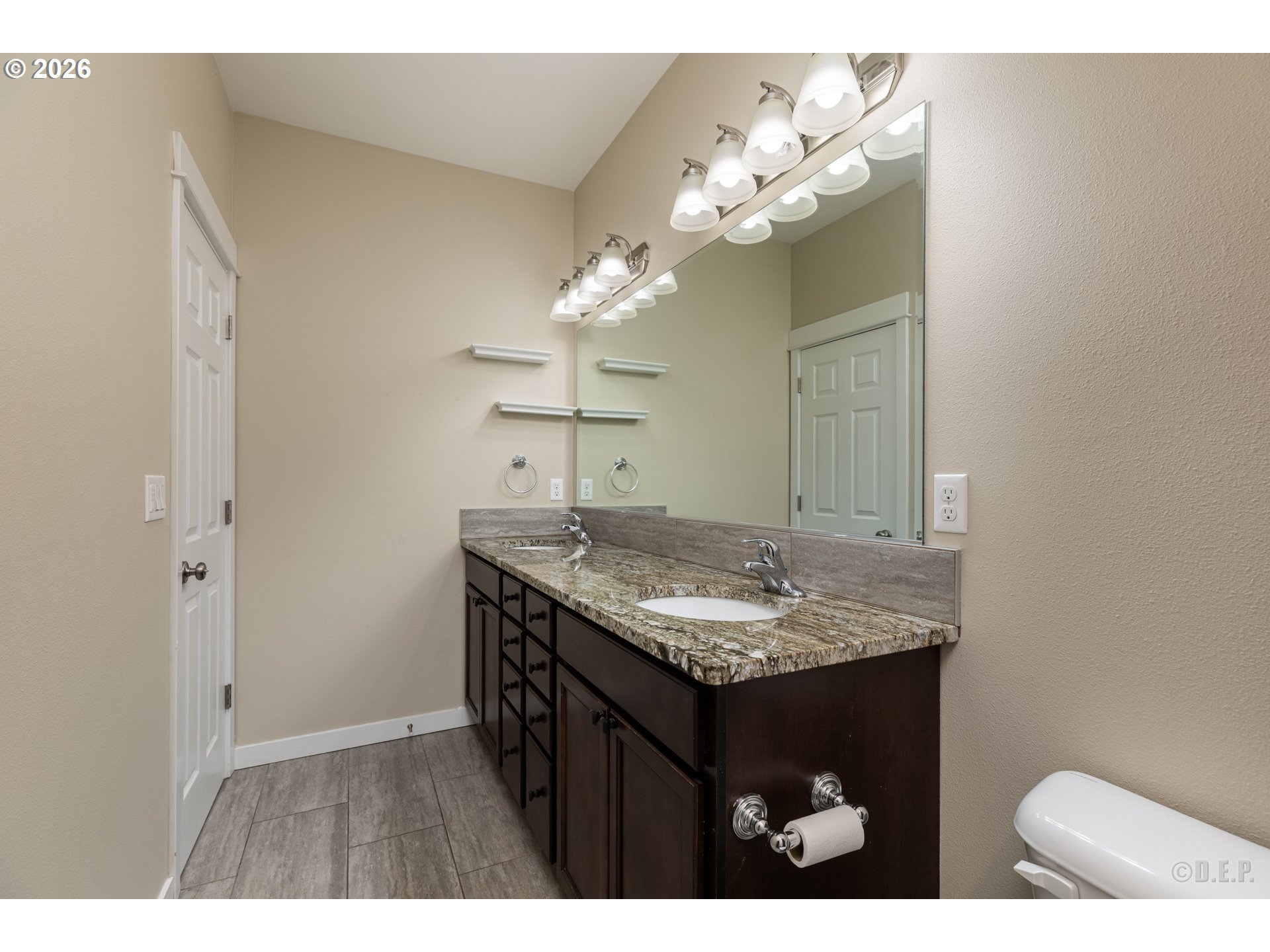 193 South 2nd Street St. Helens, OR 97051 - Photo 13 of 23 a bathroom with a granite countertop sink a mirror and a vanity