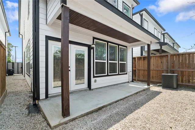 a view of a entrance gate of a house with wooden floor