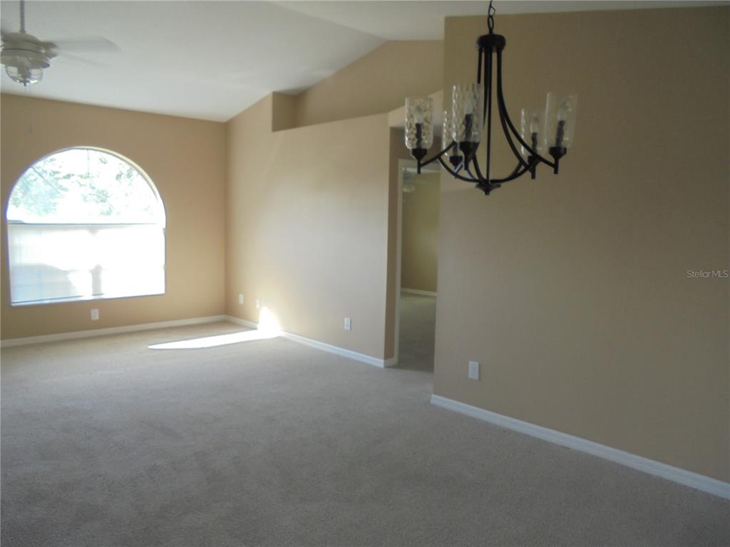 1509 Northeast 46th Road Ocala, FL 34470 - Photo 16 of 28 a view of a room with window and a white wall