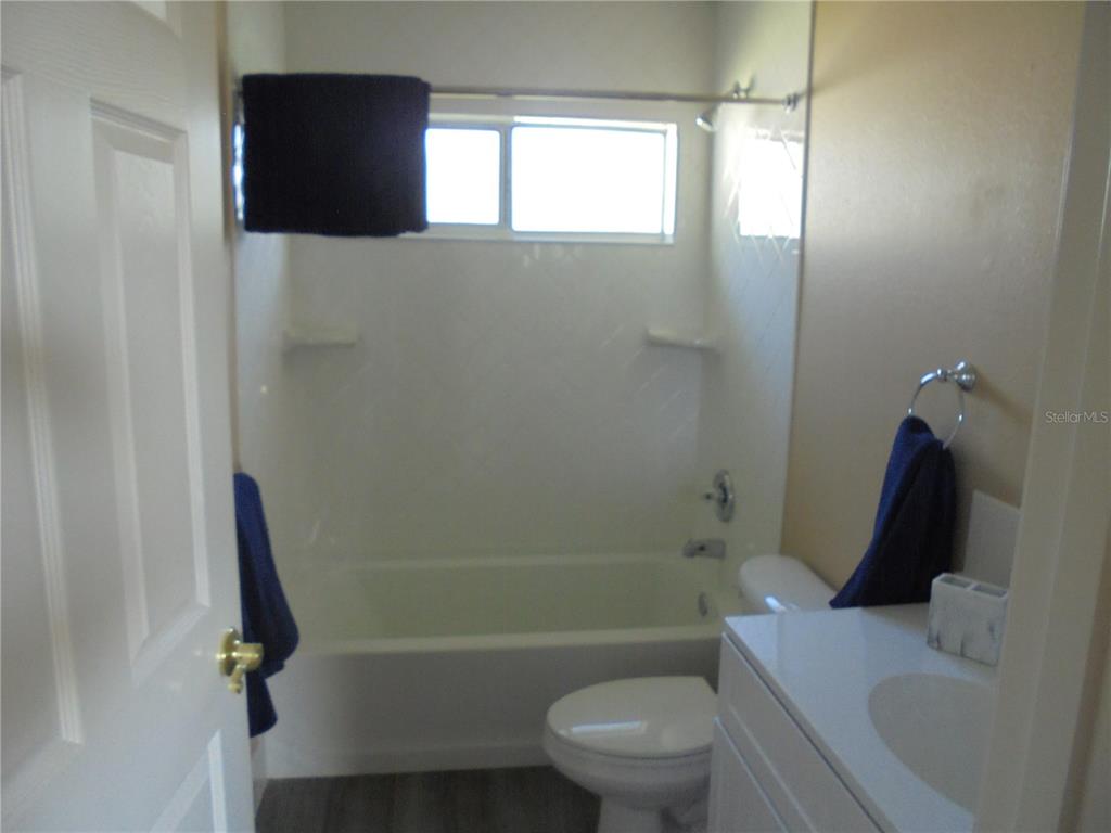 1509 Northeast 46th Road Ocala, FL 34470 - Photo 17 of 28 a bathroom with a toilet and a shower
