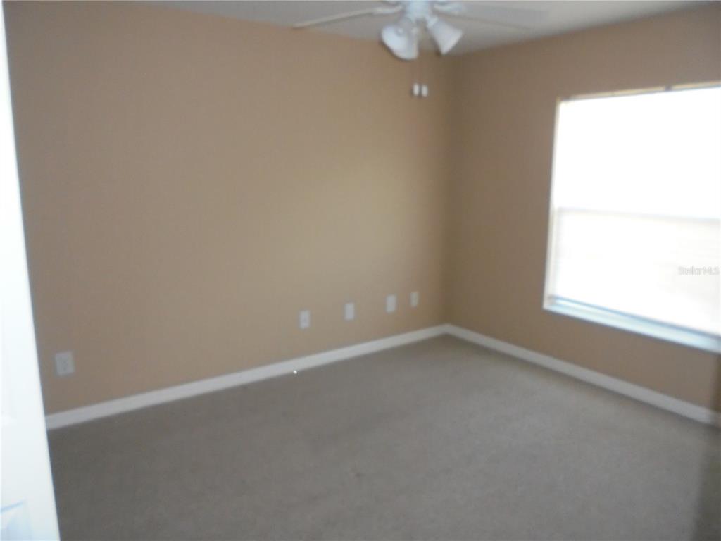 1509 Northeast 46th Road Ocala, FL 34470 - Photo 18 of 28 an empty room with a window