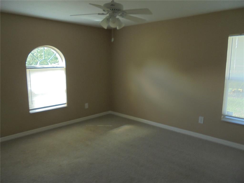 1509 Northeast 46th Road Ocala, FL 34470 - Photo 19 of 28 an empty room with a window