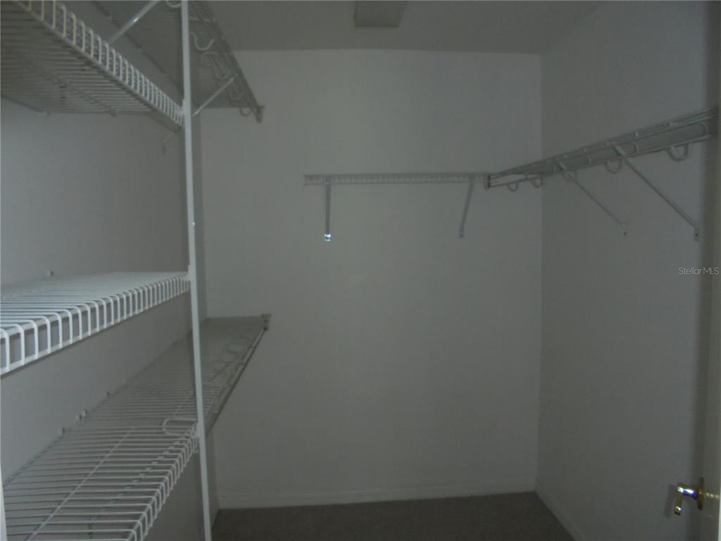 1509 Northeast 46th Road Ocala, FL 34470 - Photo 25 of 28 a view of a room with racks on the wall