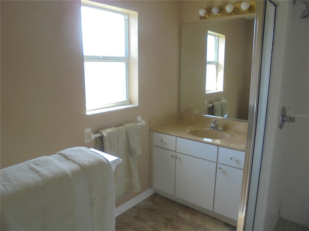 1509 Northeast 46th Road Ocala, FL 34470 - Photo 26 of 28 a bathroom with a sink and vanity