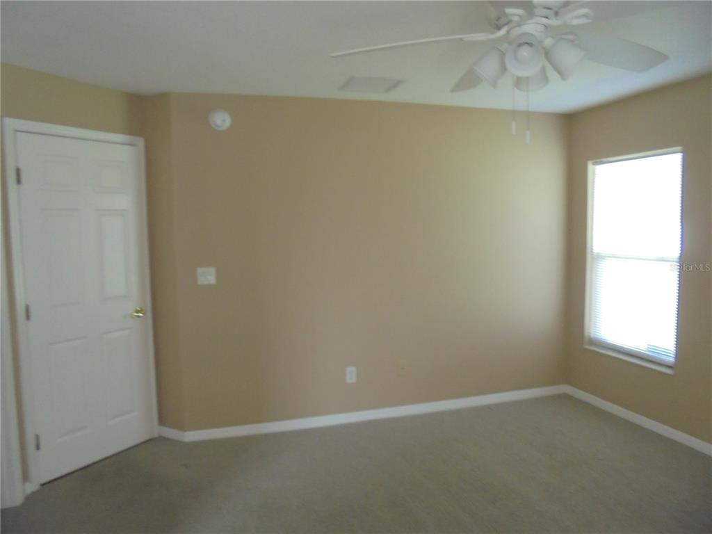 1509 Northeast 46th Road Ocala, FL 34470 - Photo 28 of 28 an empty room with a window