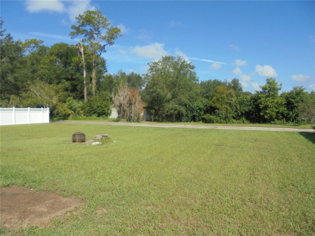 1509 Northeast 46th Road Ocala, FL 34470 - Photo 4 of 28 a view of a lake and a yard